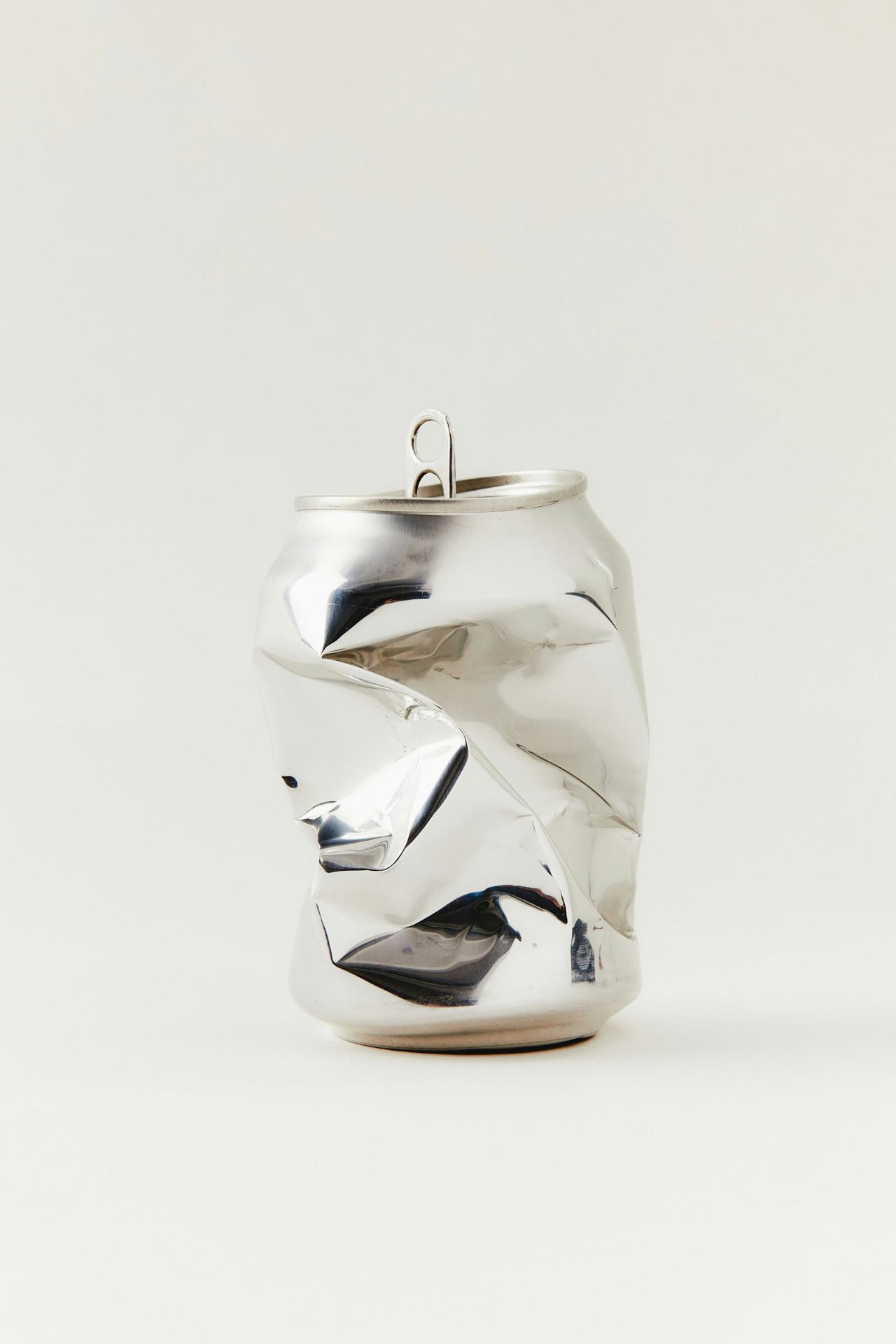 A crushed silver aluminum can